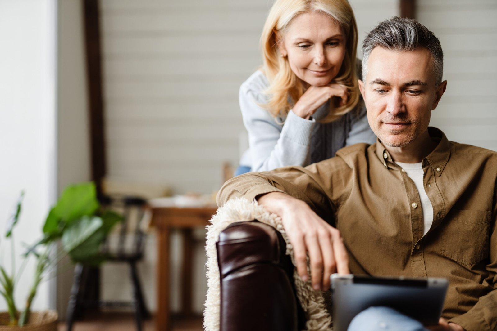 Eternal Health Solutions - Middle age couple reviewing hormone replacement therapies.