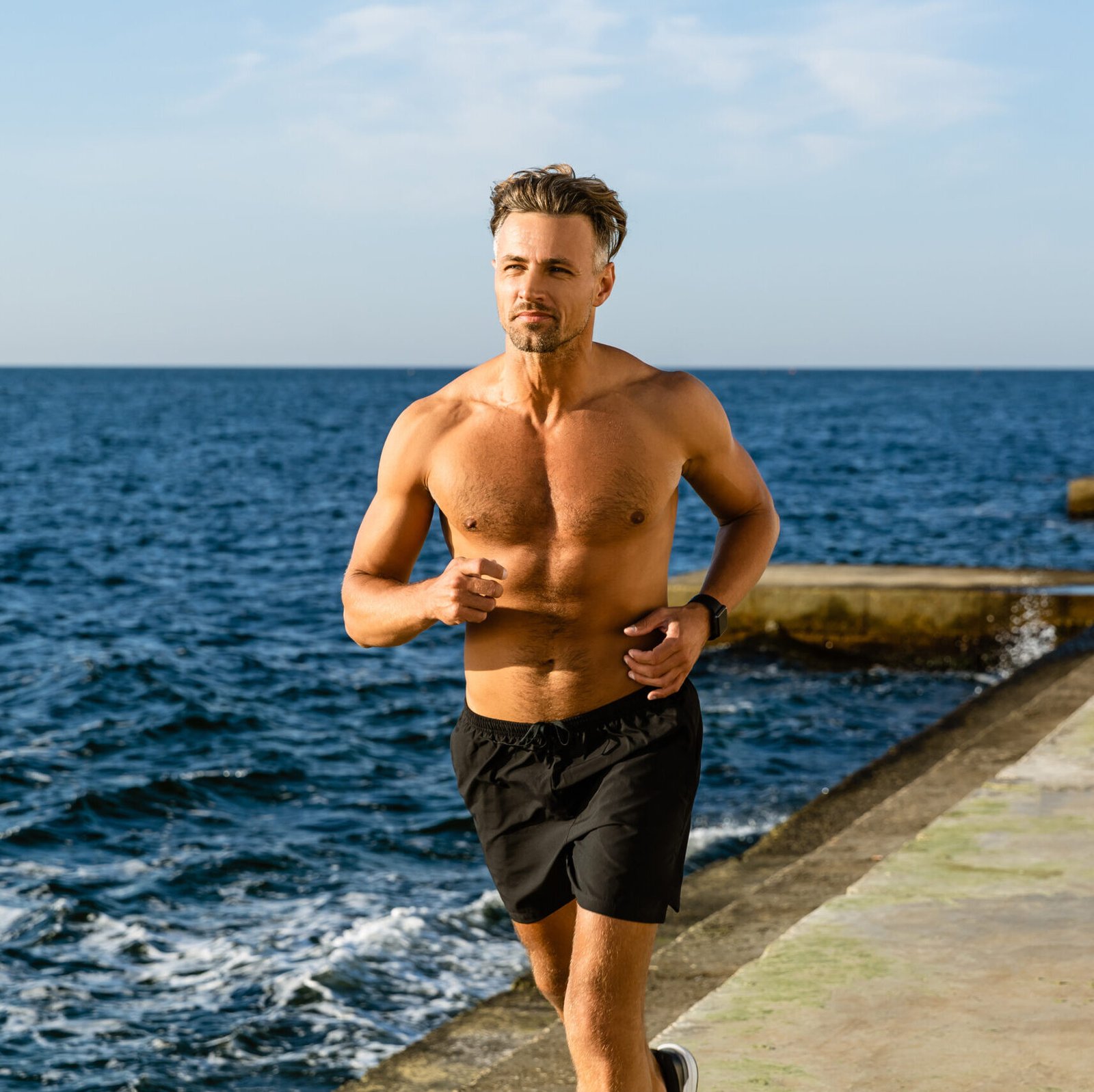 Eternal Health Solutions - fit adult shirtless man jogging on seashore